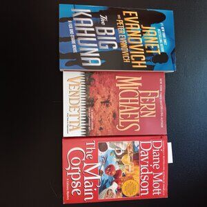 Three paperbacks by Mott Davidson, Michaels, and Evanovich